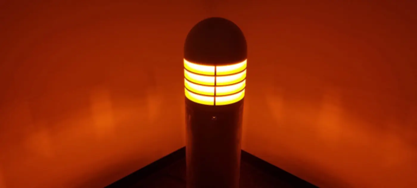 Amber wildlife friendly bollard lit at night