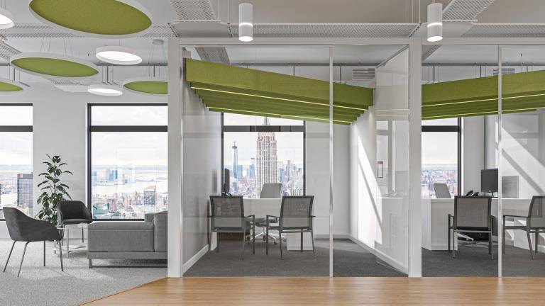 Skydome Edge Acoustic discs and Skydome Edge luminaires over workstations.