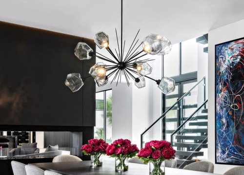 Gem Oval Starburst chandelier over a dining island, by Hammerton