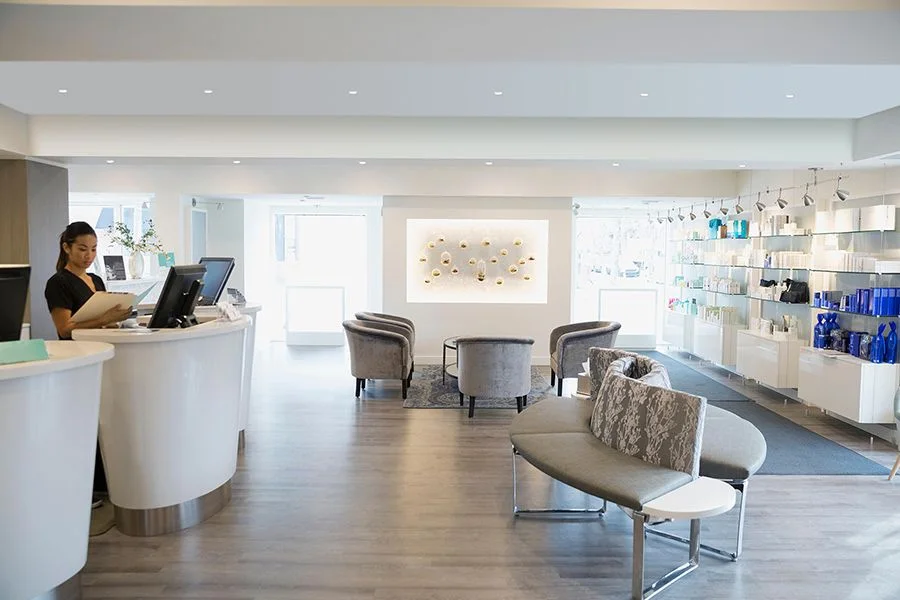 Salon and retail interior with recessed downlighting and track
